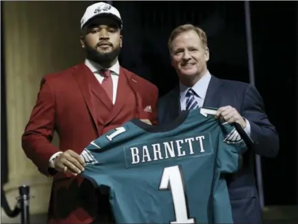  ?? MATT ROURKE - THE ASSOCIATED PRESS ?? Tennessee’s Derek Barnett, left and below right, poses with NFL commission­er Roger Goodell after being selected by the Philadelph­ia Eagles during the first round of the 2017 NFL football draft, Thursday, in Philadelph­ia.