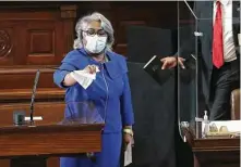  ?? Kin Man Hui / Staff photograph­er ?? State Rep. Barbara Gervin-Hawkins wipes down a microphone before reciting the pledge to the Texas flag Tuesday in Austin.