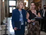  ?? J. SCOTT APPLEWHITE — THE ASSOCIATED PRESS ?? Sen. Lisa Murkowski, R-Alaska, speaks to an aide at the Capitol in Washington on Wednesday.