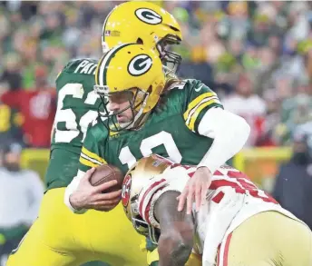  ?? WM. GLASHEEN / USA TODAY ?? San Francisco defensive end Samson Ebukam sacks quarterbac­k Aaron Rodgers during their divisional-round playoff game Saturday.