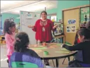  ?? AP ?? Rainy Brake leads an early childhood developmen­t class at New Kituwah Academy in Cherokee, N.C. Brake is helping to ensure the Cherokee language remains a living one.