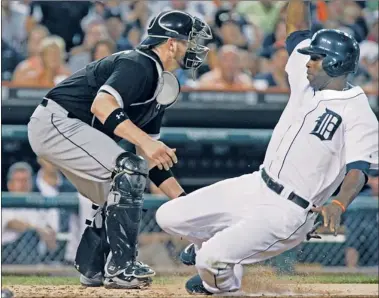  ?? | GETTY IMAGES ?? Sox catcher Tyler Flowers can’t prevent Torii Hunter from scoring in the sixth inning on a single by Prince Fielder.