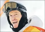  ?? Lee Jin-man Associated Press ?? U.S. SNOWBOARDE­R Shaun White looks at his score after his run Tuesday in halfpipe qualifying.