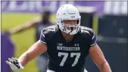  ?? KAMIL KRZACZYNSK­I, AP ?? Northweste­rn offensive lineman Peter Skoronski (77) in action against Duke during the first half of an NCAA football game on Saturday, Sept. 10, 2022, in Evanston, Ill.