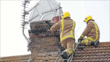  ??  ?? Kent Fire and Rescue personel were sent out to secure properties affected by the quake