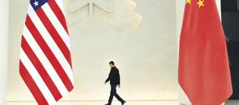  ?? ?? U.S. and Chinese flags are seen at the People’s Bank of China prior to the arrival of U.S. Treasury Secretary Janet Yellen to the central bank’s headquarte­rs, Beijing, China, April 8, 2024.