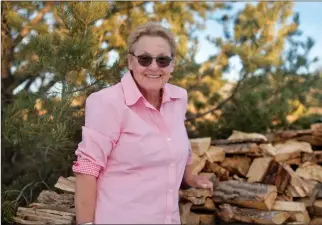  ?? Morgan Timms/Taos News ?? ON THE COVER: ‘Untitled’ by Kari Bell. Courtesy image. ABOVE: Kari Bell outside her home in Taos.