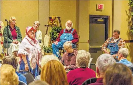  ?? CONTRIBUTE­D PHOTO ?? Musicians Don and Susan Garrett lead a traditiona­l Appalachia­n song.