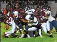  ?? AUSTIN HERTZOG - DIGITAL FIRST MEDIA ?? Pottsgrove’s Javon Colbert (32) and Isaiah Glover (5) team up to tackle Pottstown’s Josiah Wiggins at the line of scrimmage Friday.