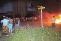  ?? Picture: ANDISA BONANI ?? SERVICE DELIVERY PROTEST: Frustrated Aloevale residents blocked Cathcart Road with burning tyres on Wednesday evening, when they were shot at by police with rubber bullets. See more pictures on Page 10