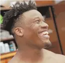  ?? STAFF PHOTO BY MATT STONE ?? LIGHTER SIDE: Patriots defensive lineman Keionta Davis laughs with the media after yesterday’s practice at Gillette Stadium.