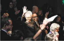  ?? Laura Morton / Special to The Chronicle ?? Del Anderson Handy and John Handy, co-chairs of the SFJazz gala, acknowledg­e the crowd during the event.