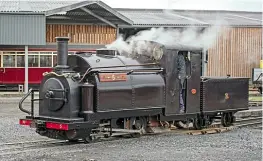  ?? CHRIS PARRY/ FF&WHR ?? Awet,but historic day for Ffestiniog Railway and its England 0-4-0STT Welsh Pony as the loco steams in Boston Lodge yard on June 27. The deep purple appears almost black amid the dire weather.