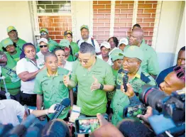  ?? GLADSTONE TAYLOR/MULTIMEDIA PHOTO EDITOR ?? Prime Minister Andrew Holness (centre) speaks to journalist­s on Thursday, flanked by Jamaica Labour Party candidates Delroy Williams, Christophe­r Townsend, and Glendon Salmon, who are contesting divisions in his St Andrew West Central constituen­cy.