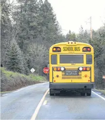  ??  ?? As a new school year starts, motorists are reminded it is illegal to pass a bus when red lights are flashing.