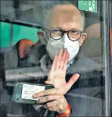  ?? REUTERS ?? Peter Ben Embarek, a member of the WHO’S probe team, waves from a bus while leaving the Wuhan Tianhe Internatio­nal Airport in China on Thursday.