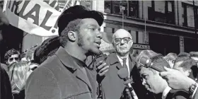  ?? AP ?? In this Oct. 29, 1969, file photo, Fred Hampton, center, chairman of the Illinois Black Panther party, speaks at a rally outside the U.S. Courthouse in Chicago. British actor Daniel Kaluuya portrays Hampton in the film “Judas and the Black Messiah.”