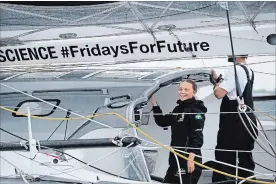  ?? CRAIG RUTTLE THE ASSOCIATED PRESS ?? Swedish teen Greta Thunberg, 16, is all smiles as she sails into New York harbour aboard the Malizia II on Wednesday. She is scheduled to address a UN climate summit Sept. 23.