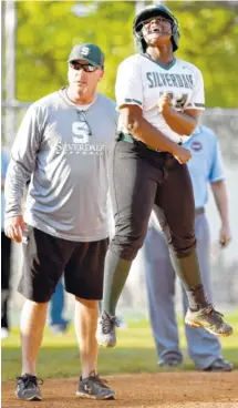  ?? STAFF PHOTOS BY ROBIN RUDD ?? Silverdale Baptist Academy’s Skylar Sheridan celebrates her three-run triple against Chattanoog­a Christian School on Tuesday in the Division II-A East District 2 tournament finals.