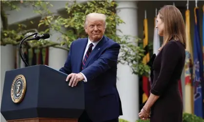  ??  ?? Donald Trump in the Rose Garden of the White House, alongside his supreme court nominee, Amy Coney Barrett. Photograph: Olivier Douliery/AFP/Getty Images
