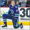  ?? JEFF VINNICK/ NHL VIA GETTY IMAGES ?? Canucks defenceman Alex Edler does his pre- game stretches without a helmet.