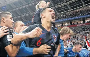  ?? AP PHOTO ?? Croatia’s Dejan Lovren celebrates after Mario Mandzukic scored his side’s second goal during the semifinal match against England at the 2018 soccer World Cup in Moscow, Russia, Wednesday.