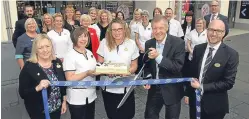  ?? Picture: Gareth Jennings. ?? Willie Rennie cuts the ribbon alongside store manager Heather Johnston, healthcare adviser Flora Herd, customer assistant Susan Stewart and area manager Kris Archibald and the rest of the Boots staff.