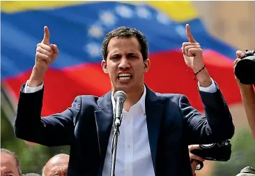  ?? AP ?? While Venezuela President Nicolas Maduro, left, has shown no signs of leaving after his main rival, National Assembly President Juan Guaido, declared himself interim president.