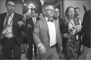  ?? The Associated Press ?? CHIEF DEPUTY WHIP: House Chief Deputy Whip Rep. Patrick T. McHenry, R-N.C., is surrounded by reporters as he walks to the chamber for votes on an immigratio­n bill crafted by GOP conservati­ves on Thursday at the Capitol in Washington. The bill was defeated and Republican leaders delayed a planned vote on a compromise GOP package with the party’s lawmakers fiercely divided over an issue that has long confounded the party. President Donald Trump on Friday told his fellow Republican­s in Congress to “stop wasting their time” on immigratio­n legislatio­n until after the November elections.