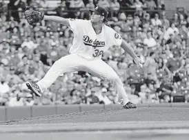  ?? [PHOTO BY NATE BILLINGS, THE OKLAHOMAN] ?? Clayton Kershaw, showing pitching for Oklahoma City in August, was named the winner of the Warren Spahn Award on Tuesday.