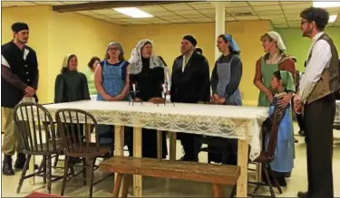  ??  ?? Tevye (Tom Nardone) and wife Golde (Sue Mangold) celebrate Shabbat dinner with their daughters, from left, Shprintze (Alyssa Bridges) Hodel (Suzie Ligammari) Tzeitel (Becky Cooper) and Chava (Emily Jones) and two houseguest­s, Motel (Colin Camp) and...