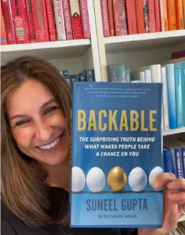  ??  ?? Carlye Adler with the book Backable