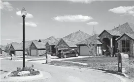  ?? [PHOTO BY JIM BECKEL, THE OKLAHOMAN] ?? New homes are shown along SE 38 in Seiter Farms addition, west of S Sunnylane Road between SE 34 and Indian Hills Road in Moore.