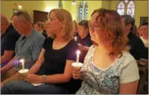  ?? BARRY TAGLIEBER — FOR DIGITAL FIRST MEDIA ?? About 100people gathered inside St. Vincent United Church of Christ in Phoenixvil­le Monday for a candleligh­t vigil service honoring the victims of Sunday’s deadly shooting in Orlando, Fla.