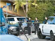  ?? ROBYN BECK/ GETTY-AFP ?? Law enforcemen­t gathers Saturday to work at the site of a shooting near Beverly Hills, Calif.