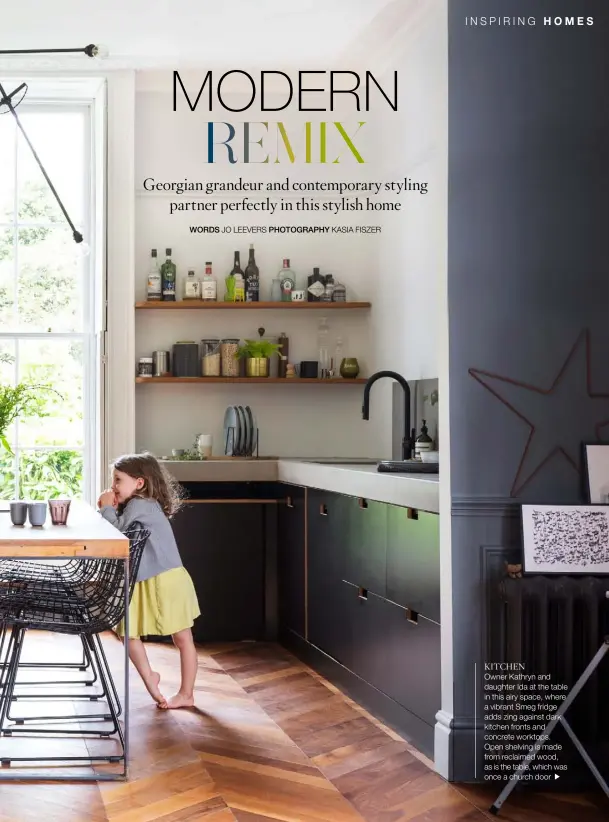  ??  ?? KITCHEN
Owner Kathryn and daughter Ida at the table in this airy space, where a vibrant Smeg fridge adds zing against dark kitchen fronts and concrete worktops. Open shelving is made from reclaimed wood, as is the table, which was once a church door