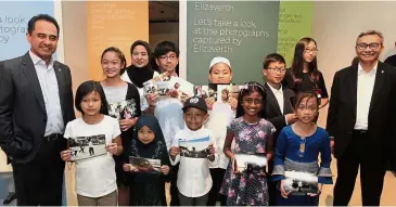  ??  ?? Unity project: Ahmad Nizam (right), Wan Zulkiflee and Zahariah (in black scarf) posing with the young talent of the TVC after the launch of ‘Ceritera Kita’ exhibition and ‘Cerita Kita’ TV commercial.