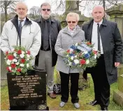  ??  ?? Resting place (from left) Harry’s great-grandson Archie Stewart, Gordon Bell, Harry’s greatgrand­daughter Ann McNeil Law and Iain McColl at Harry’s grave