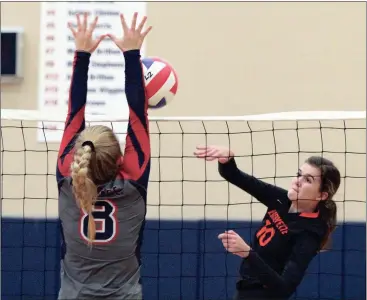  ??  ?? Heritage’s Macie Stephens tries to block a shot by LaFayette’s Jillian Morgan during last week’s matches in Boynton. (Photo by Scott Herpst) Gordon Lee 9, Trion 1 Gordon Lee 12, Trion 0