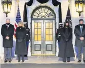  ?? EVAN VUCCI/AP ?? President Joe Biden, first lady Jill Biden, Vice President Kamala Harris and her husband, Doug Emhoff, bow their heads during a ceremony to honor the 500,000 Americans who have died from COVID-19, at the White House in Washington on Monday.