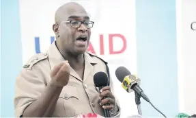  ??  ?? Senior Superinten­dent Steve McGregor addresses residents at the opening ceremony of the Kintyre Citizens’ Associatio­n Community Resource Centre in East Rural St Andrew.