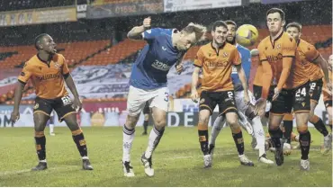  ??  ?? 0 Scott Arfield’s header hits the woodwork as Rangers apply the pressure