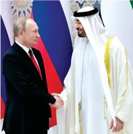  ?? Reuters ?? WARM WELCOME: Sheikh Mohamed bin Zayed Al Nahyan greets Russian President Vladimir Putin in Abu Dhabi on Tuesday. —