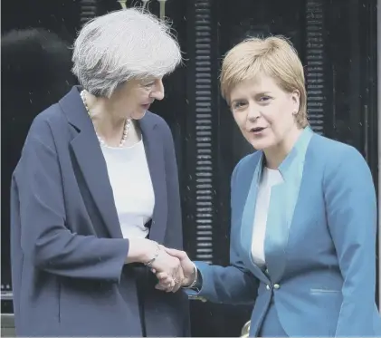  ??  ?? 0 Theresa May’s UK ministers and Nicola Sturgeon’s Scottish Government must get on the same wavelength