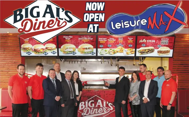  ??  ?? NOW OPEN AT Head of sales for Kepak Food Services, Neil Byrne, cuts the tape at the official opening of BIG AL’S Diner at Leisure Max.