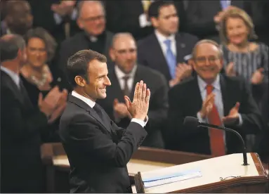  ?? Win McNamee / Getty Images ?? French President Emmanuel Macron addresses a joint meeting of Congress at the Capitol on Wednesday in Washington, DC. Macron met Tuesday with President Donald Trump and Wednesday turns his attention to the U.S. legislativ­e body.