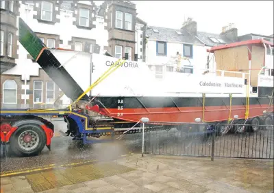  ?? 08_a33Kerrera­Ferry01 ?? MV Carvoria passed through Lochgilphe­ad during one of the day’s heavier showers.