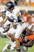  ?? OKLAHOMAN] [PHOTO BY NATE BILLINGS, THE ?? Oklahoma State defensive tackle Enoch Smith Jr. wraps up a Tulsa player in a game last season in Stillwater.