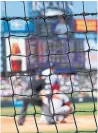  ?? DOUG PENSINGER GETTY IMAGES ?? MLB parks have added safety netting to protect fans from foul balls and flying bats.