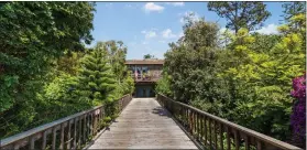  ?? ?? This Laguna Beach home at the end of a 75-foot bridge driveway is on the market for $2.6 million.